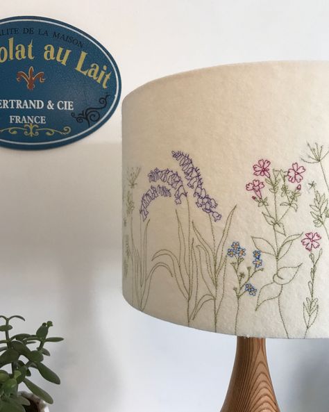 A freehand machine embroidered Cornish Hedgerow lampshade. A neutral colour felt background using different colour threads to stitch the hedgerow including bluebells, pink campion and cow parsley.  **NOW AVAILABLE ON A CHOICE OF FELT OR 100% COTTON** please message me if you would like cotton. Please choose the size you require from the drop down menu, and send me a message if you would like a table or a ceiling shade. If no preference is made it will automatically be made as a table shade.  Eac Embroidered Lamp, Embroidered Lampshade, Table Shade, Painting Lamp Shades, Ceiling Shades, Diy Lamp Shade, Beautiful Greeting Cards, Liberty Print, Diy Lamp