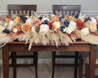 Navy Terracotta Wedding Table, Navy And Orange Wedding Flowers, Navy And Rust Wedding Table Decor, Navy Blue And Burnt Orange Wedding Centerpieces, Navy Blue And Terracotta Wedding Centerpieces, Burnt Orange And Blue Wedding, Rust And Navy Blue Wedding, Navy Blue And Terracotta Wedding, Wedding Arch Flowers