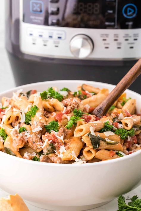 You'll love this Instant Pot Pasta with Sausage, Spinach, and Tomatoes. You might have all the ingredients on hand already! It's healthy, satisfying, easy, and versatile. Instant Pot Spinach, Sausage Spinach Pasta, Instant Pot Pasta, Dinner 2023, Sausage Spinach, Pasta With Sausage, Instant Pot Pasta Recipe, Cooking Dried Beans, Tomatoes Recipe