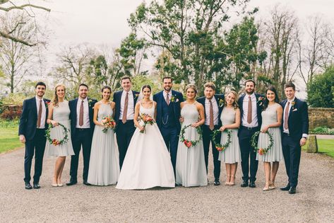 Summer bridesmaids in pale green bridesmaid dresses and groomsmen in navy suits with pink ties for a stylish wedding at Elmore Court. Image by Rob Tarren Photography #weddingparty #bridesmaids #summerbridesmaids #palegreenbridesmaiddresses #elmorecourtwedding #suzannenevilleweddingdress Green Bridesmaid Dresses And Groomsmen, Pale Green Bridesmaid Dresses, Suits With Pink Ties, Bridesmaid Dresses And Groomsmen, Groomsmen In Navy, Suzanne Neville Wedding Dresses, Elmore Court, Mix Match Bridesmaids, Navy Suits