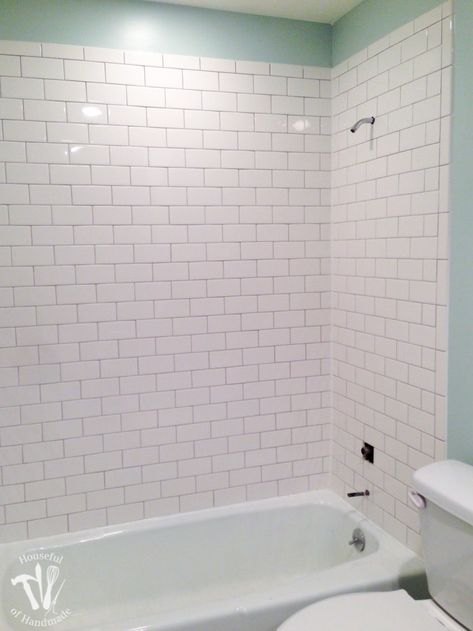 Before choosing subway tile for your next project read this! We tested out tiling our tub surrounds with both individual subway tiles and subways tile sheets. Here we compare the difference in price, installation and appearance so you can make an informed decision for your next tile project. Housefulofhandmade.com 3x6 White Subway Tile, Tile Around Tub, Bathtub Tile Surround, Tile Around Bathtub, Bathtub Shower Remodel, White Subway Tile Bathroom, Guest Bathroom Renovation, Tile Tub Surround, Beveled Subway Tile