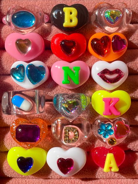 Feel 'TWICE THE LOVE' in our new lucky rings! Made with reworked acrylic resin materials, we customize your piece in-house with hand-painted resin for maximum shine and nostalgic charm.Stack away! ♡ Purple Monochrome, Baby Doll Hair, Lucky Ring, Lucky Charm Necklace, Candy Necklaces, Good Color Combinations, Pink Rainbow, Resin Ring, Initial Ring