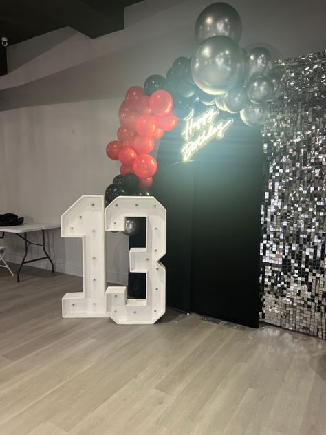 Red, black and silver balloons on a sequence wall Red Black And Silver Balloons, Red Black White Silver Party Decorations, Red And Silver Birthday Decorations, Red Black And Silver Party Decoration, Black And Silver Balloons, Sequence Wall, Silver Party Decorations, Masquerade Party Decorations, Silver Balloons