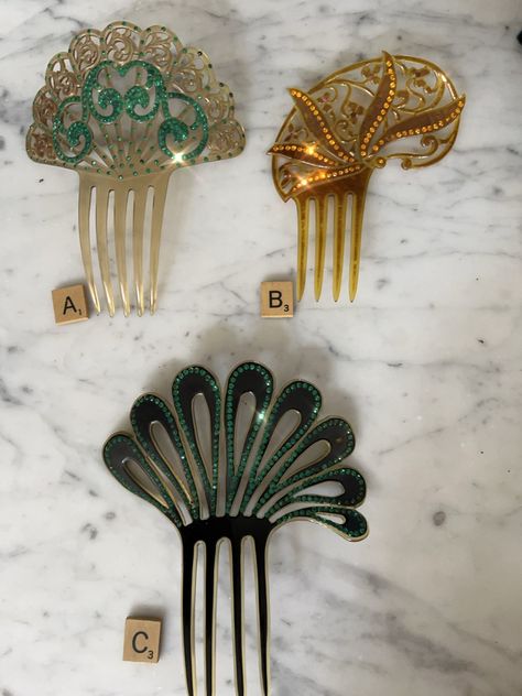 These exceptional decorative hair combs come from the estate of a woman who loved elaborate hair combs.  The colours are fabulous.  These outstanding examples are made of celluloid and further embellished with coloured rhinestones.  They are all in excellent condition and come from the art deco period. Comb A has one green rhinestone missing from centre (see photo)  Comb C has a chip and slight crackling on one upper frond. See photo. Measurements are in photos  The price is for one comb. Please Historical Recipes, Art Deco Accessories, Antique Hair Combs, One Upper, Vintage Comb, Decorative Hair Combs, Art Deco Hair, Art Nouveau Poster, Hair Combs