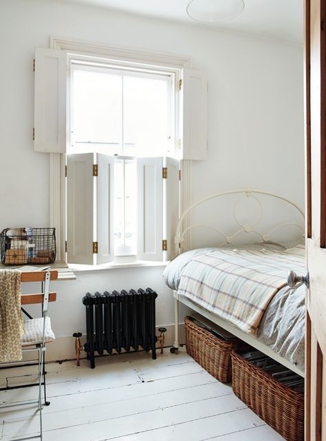 Sara Emslie London bedroom with Shutters / Remodelista Shutters Interior, Indoor Shutters, Interior Window Shutters, Interior Shutters, Country Cottage Decor, Window Shutters, Under Bed, Guest Bedrooms, Cottage Decor