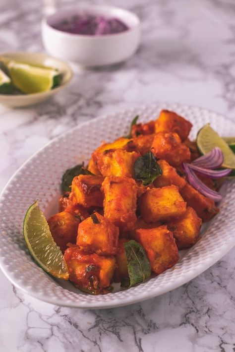 Paneer 65 - better than you’ve ever had before! This Hyderabadi paneer starter recipe is deliciously bright, flavorful, spicy and super easy to make. Instead of deep frying, I have used the air fryer. You get bite-sized pieces of paneer that are air-fried to golden brown perfection, and the fried cubes are then coated in the most amazing, spicy, slightly tangy sauce. Talk about delicious street/restaurant food made healthy! #paneer #IndianFood #VegStarters #Airfryer Hyderabadi Paneer, Indian Starter Recipes, Paneer 65, Paneer Starters, Desi Dishes, Veg Breakfast, Street Restaurant, Chilli Paneer, Paneer Dishes