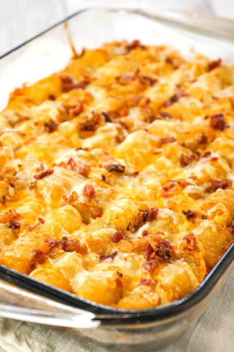 Tater Tot Breakfast Casserole is a hearty casserole recipe loaded with pork sausage meat, diced onion, chopped ham, crumbled bacon, eggs, shredded cheese and topped with tater tots. Tot Breakfast Casserole, Tater Tot Recipes, Tater Tot Breakfast Casserole, Sausage Meat, Tater Tot Casserole Recipes, French Toast Casserole Overnight, Yummy Casserole Recipes, Tater Tot Breakfast, Chopped Ham