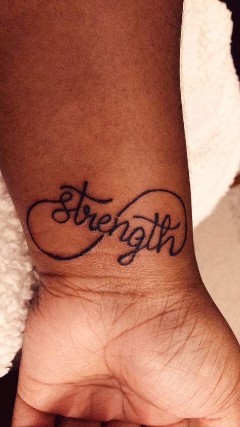 Tattoos That Show Strength For Women, Strength Wrist Tattoos For Women, Strength Tattoos For Women Forearm, Women’s Strength Tattoo, Strength In Cursive Tattoo, Strength Cross Tattoo, Encouragement Tattoos, Tattoos That Signify Strength, Strength Tattoos For Women