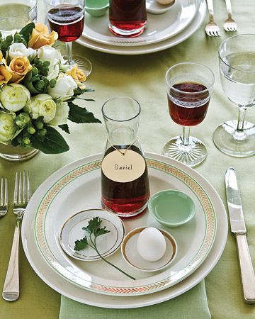 PASSOVER SEDER ~ In addition to displaying the main seder plate, incorporate some symbolic foods into individual place settings, add carafes of wine that can double as place card holders. With everything in reach, guests will have what they need during the reading of the Haggadah, keeping the passing of the seder plate -- and the risk of spills at the table -- to a minimum. Martha Stewart Entertaining, Passover Table Setting, Passover Seder Table, Passover Dinner, Martha Stewart Holiday, Seder Meal, Passover Table, Passover Seder Plate, Seder Table