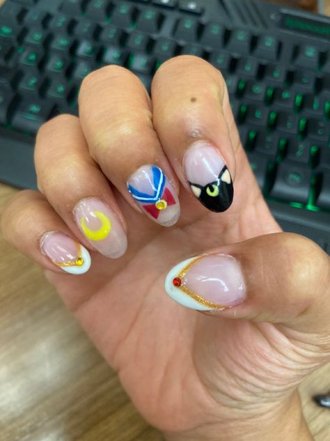 Nail art idea. Sailor moon inspired with four different designs on the nails Anime Nails Sailor Moon, Sailor Moon Inspired Nails Simple, Sailor Moon Nail Art Design, Short Sailor Moon Nails, Sailormoon Nail Design, Sailor Moon Nails Simple, Sailor Moon Nails Acrylic, Sailor Moon Nails Design, Sailor Moon Inspired Nails