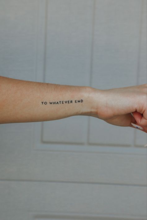 Woman shows off her small wrist tattoo that says “To Whatever End” Tell Me Tomorrow Tattoo, Curse Breaker Tattoo, You Do Not Yield Tattoo, To Whatever End Tattoo, Book Quotes Tattoo, Book Inspired Tattoos, Tattoo Queen, Big Tattoos, End Tattoo