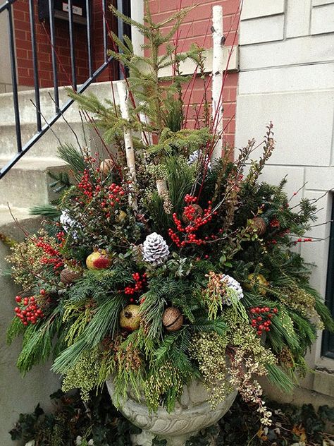 20 Beautiful Winter Planter Ideas - House of Hawthornes Xmas Arrangements Outdoor Planters, Christmas Planter With Lantern, Faux Winter Planters, Christmas Urn Filler Ideas, Diy Winter Planter, Faux Outdoor Christmas Planters, Whiskey Barrel Christmas Decor, Christmas Planter Boxes, Winter Pots Outdoor Front Doors