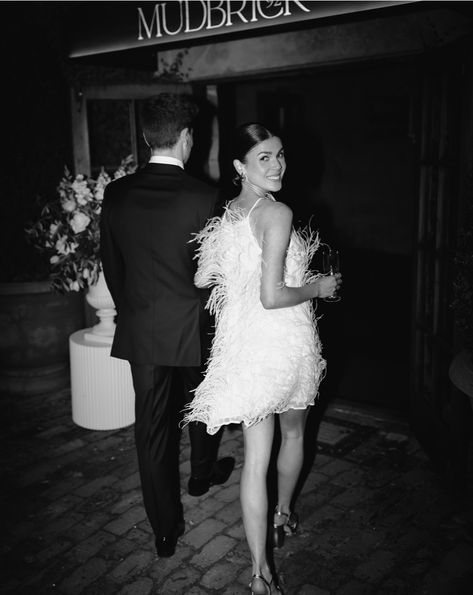 Add a touch of luxury and drama with a feather-adorned dress. Perfect for a glamorous and unforgettable night.  Image via @hollowandco Wedding After Party Dresses, Wedding After Party Dress, After Party Dress, Floral Styling, Wedding After Party, Chic Brides, Let Your Hair Down, Big Night, Cocktail Attire