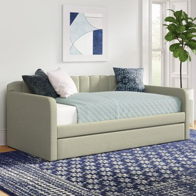 Sofa by day; bed by night. This daybed comes with a pullout trundle, so it's the ideal spot for overnight guests. It has a solid and engineered wood frame that's fully wrapped in polyester upholstery, and its neutral tone matches a variety of styles and color palettes. Track arms and a shell-inspired back design bring a classic mid-century modern look to any room. Slats are included to help support both twin mattresses (sold separately). Full assembly is required. | Mercury Row Vandoren Twin Day Twin Daybed With Trundle, Twin Daybed, Mattress Storage, Upholstered Daybed, Daybed With Trundle, Day Bed, Bed Slats, Twin Mattress, Guest Bed