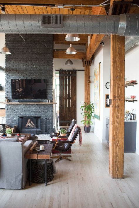 An industrial Chicago loft living room with exposed beams & ducts, and a gray painted fireplace wall. Grey Painted Fireplace, Living Room Zones, Living Room Loft, Loft House, Loft Living, Industrial Loft, Bedroom Loft, Living Room With Fireplace, Living Room Grey