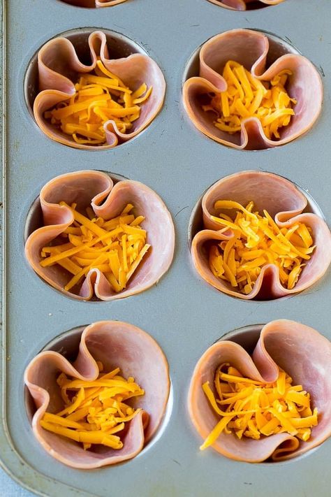 Ham pressed into muffin tins and topped with shredded cheese. Ham And Egg Cups, Ham Egg Cups, Breakfast Ham, Easy Make Ahead Breakfast, German Breakfast, Keto Breakfast Muffins, Egg Cups Recipe, Keto Breakfast Smoothie, Easy Breakfast Options