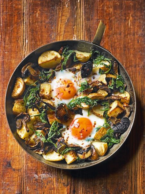 This baked eggs recipe is made using just one pan and is great to share for brunch Eggs With Mushrooms, Eggs Potatoes, Menu Sarapan Sehat, Egg Benedict, Baked Eggs Recipe, Delicious Magazine, Spinach Recipes, Baked Eggs, Deviled Eggs