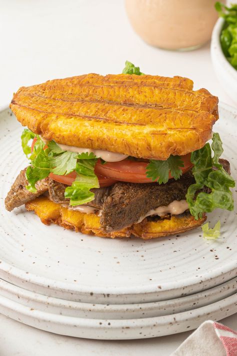 This 30 minute Jibarito is made with fried plantains instead of bread and filled with all of your favorite sandwich ingredients. It's a truly delicious piece of Puerto Rican American culture, full of unique flavor and texture. Plantain Sandwich Recipe, Tostones Sandwich, Jibarito Sandwich Puerto Rico, Puerto Rican Food Authentic, Puerto Rican Recipes Authentic, Jamaican Food Recipes, Plantain Sandwich, Green Plantain Recipes, Puerto Rican Mofongo