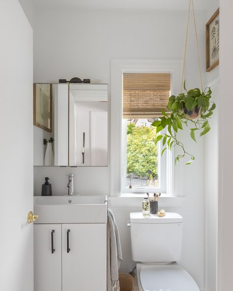 • this tiny bathroom is ohhhhh so cute in our #threetreepointroomrefresh ✨🧻🧺 —— even if the space is small it still can have a big impact on your homes overall style. We love the mixing of the old vintage touches with the new more modern elements + the black & silver combination here is timeless ✨ Work with us today to transform your space big or small! Design + Styling: @devaughndesign Photography: @shellyborga #devaughndesign #threetreepoint #burieninteriordesign #westseattleinterior... Black In Bathroom, Hanging Pothos, Wood Window Treatments, Black With Chrome, Brushed Nickel Bathroom, Wood Window, Pothos Plant, Woven Wood, Modern Elements