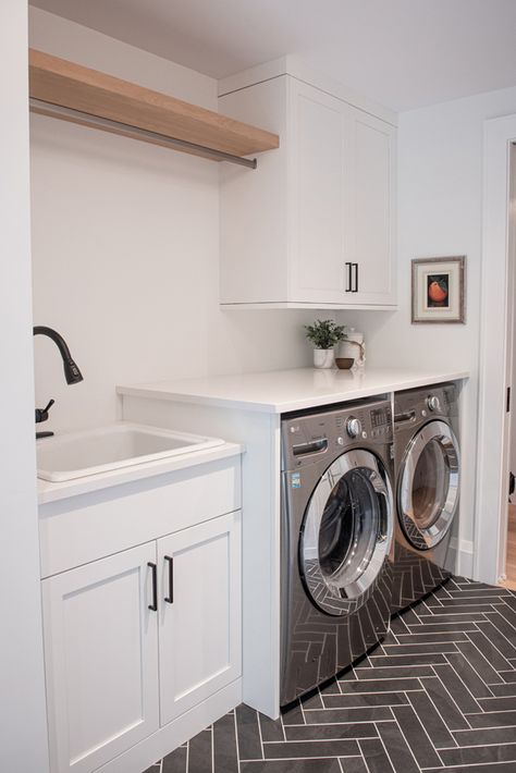 Custom machine unit, white cabinetry, and black herringbone tiles 2nd Floor Laundry Room Ideas, Black And White Laundry Room Tile, White And Black Laundry Room, Black And White Tile Laundry Room, Tiles For Laundry Room, Laundry Tiles, Black And White Laundry Room, Cottage Laundry, Black Herringbone Tile