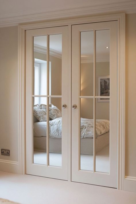 Create the illusion of a larger bedroom with mirrored closet doors. These sleek and stylish doors reflect light, making your space feel more open and airy. 🪞✨ #MirroredDoors #SpaciousLiving #BedroomDecor #ElevatedCloset Rooms With Mirror Closet Doors, Closet Door Mirrors, Doors With Mirrors Inset, Mirrored Closet Door Ideas, Cover Mirror Closet Doors, Closet Doors With Mirrors, Dressing Room Doors, Mirrored Closet Doors, Narrow French Doors