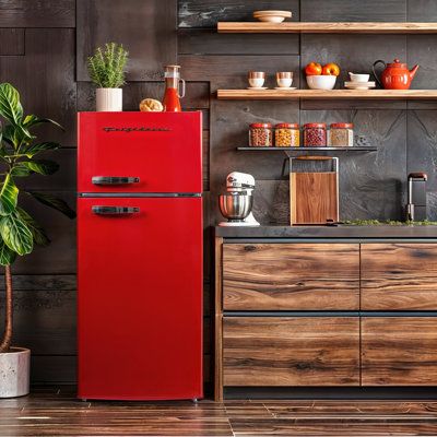 The Frigidaire Retro Refrigerator seamlessly blends retro aesthetics with modern convenience thanks to its sleek stainless steel finish, classic chrome trim, and vintage-inspired pull handles. Stylish and functional, this small fridge freezer comes with ample storage including three adjustable, slide-out glass shelves, a transparent vegetable crisper, and four clear door shelves. Color/Finish: Red | Frigidaire 7.5 CU. FT. Apartment Size Refrigerator (Retro Design) in Gray | 57 H x 23 W x 25 D in Red Fridge Kitchen Design, Small Fridge Kitchen, Small Refrigerator Ideas, Colored Refrigerator, Colorful Appliances, Green Fridge, Small Fridge Freezer, Apartment Size Appliances, Mini Fridge Cabinet