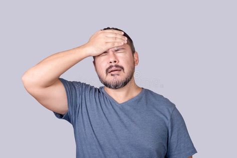 A man face palms, slapping his forehead in frustration. Feeling embarrassed or dismayed stock photography Feeling Embarrassed, Migraine Attack, Man Face, Male Face, Migraine, A Man, Photo Image, Massage, Temple