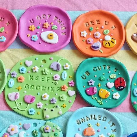 girlscape on Instagram: "12 cute positivity trinket dishes and 3 wall hangings coming tomorrow!!! 6pm UK time 💖🌷🐞☀️✨🐸 - - - - - - #polymerclay #polymerclayjewellery #polymerclaycrafts #trinkettray #trinketdish #ringholder #ringdish #rainbowaesthetic #clayart #clayartist #polymerclaytrinketdish #polymerclayearrings #claytray #homedecor #kawaiihomedecor #kawaiistyle #kawaiiaesthetic #cottagecore #handmadejewelry #handmadeuk #smallbusiness #smallbusinessuk #etsyhandmade #etsyshop #etsysellersof Polymer Clay Hanging Wall Art, Air Dry Trinket Dish, Polymer Clay Wall Hangings, Trinket Dish Ideas, Polymer Clay Tray, Air Dry Clay Trinket Dishes, Diy Trinket Dish, Clay Trinket Tray, Polymer Clay Dish