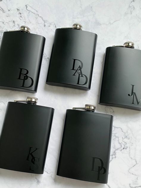 Our personalized stainless steel hip flask is the perfect gift to tuck into your proposal bags or boxes for the bridal party! Your groomsmen and bridesmaids are sure to love their completely personalized flasks! It's stainless steel and holds 8 ounces. Choose from various font colours and styles for either your bridesmaids or groomsmen! *due to shipping costs, please note a minimum of 3 per order. Orders with less than 3 selected for your quantity will unfortunately be cancelled* YOU MAY ALSO LIKE: METAL BOTTLE OPENER GROOMSMEN GIFTS: https://www.etsy.com/ca/listing/1354614046/personalized-bottle-opener-gift-for?click_key=2667cc8b66c43a6d9785d0487d7524390fa1da52%3A1354614046&click_sum=033462ea&ga_search_query=BOTTLE&ref=shop_items_search_1&pro=1&frs=1 PERSONALIZED GIFT BAGS: https://www.et Personalized Flask, Groomsman Proposal Box, Groomsmen Proposal Gifts, Groomsmen Flask, Bridesmaid Groomsmen Gifts, Weddings Idea, Bachelor Gifts, Bachelor Party Gifts, Wedding Gifts For Groomsmen