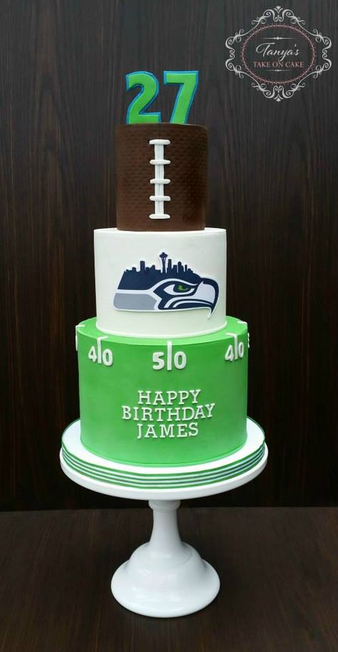 Seahawks fondant cake. Seahawks fan, 12th man, football cake, birthday cake, seattle skyline, yardline cake, green blue. Seahawks Birthday Party, Green Bay Cake, Seattle Seahawks Cake, Seahawks Cake, Seahawks Party, Football Room, Sports Cakes, Birthday Cake For Husband, New Birthday Cake