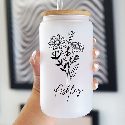 Personalized Tumbler | Tumbler with Straw | Personalized Tumbler with Straw | Glass Beercan Tumbler | Glass Tumbler w/Glass lid, Glass Straw These Birth Flower Glasses are handmade by us at Sip-Sip Hooray! from 100% borosilicate glass which is known for its thickness, sturdiness, and clarity. The cute designs are handmade and designed with high quality and long lasting printing. These cute iced coffee cups with sustainable bamboo lid and glass straw are perfect for all of your adventures. Take it on the go with your busy lifestyle, these can shaped glassware cups hold up to 16oz of all your favorite beverages. The snug-fitting bamboo lid with silicone sleeve allows you to take on the run with you and seals tightly to prevent any spillage. The large diameter glass straw is reusable and sust Cup Decal Ideas, Diy Glass Cups, Cricket Designs, Cricut Cups, Flower Glasses, Glass Tumbler Design, Cricut Gifts, Cup Decorating, Tumbler Glass