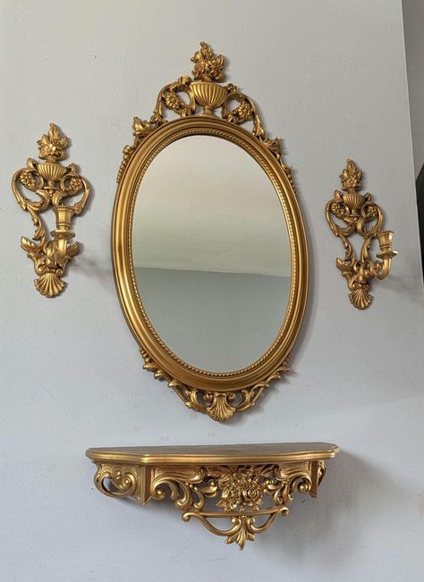 Vintage Victorian style 1960's gold syroco oval mirror set with shelf and candle holders. Plastic frame. Shelf has some pinhole size paint splatters on top (shown in pictures). Measurements: mirror- 31" length × 16" width shelf- 19" length × 6 1/2" height × 8" depth candle holder- 13 1/2" length × 5 1/2" width × 5 1/4" depth *Please understand that these are previously loved vintage items, so they will come with their naturally aged wear and charm* Victorian Shelves, Shelf Length, Pvc Canopy, Family Pictures On Wall, Mirror Shelf, Hall Mirrors, Eclectic Cottage, Wall Mirror With Shelf, Gallery Wall Inspiration