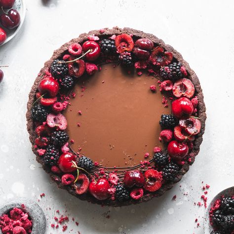 This delicious tart has chocolate shortbread, sweet cherry raspberry jelly and smooth creamy chocolate ganache, topped with forest fruits. Black Forest Ice Cream, Chocolate Fruit Cake, Fruit Tart Recipe, Freeze Dried Raspberries, Chocolate Crust, Forest Fruits, Dried Raspberries, Frozen Cherries, Chocolate Fruit