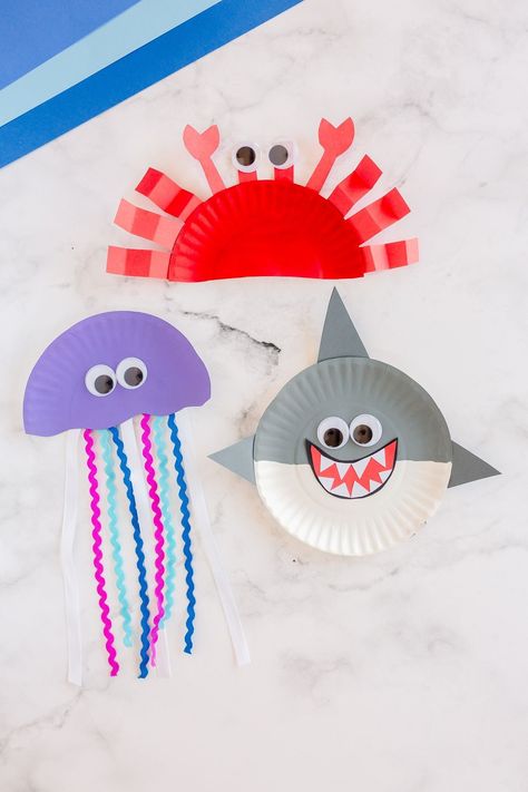 These easy paper plate ocean animals are so fun to make! You only need a few craft supplies to make a crab, jellyfish and a silly shark! Shark Week Crafts For Kids, Shark Crafts For Kids, Paper Plate Crab, Shark Crafts, Paper Plate Jellyfish, Plate Crafts For Kids, Paper Plate Fish, Sea Animal Crafts, Ocean Animal Crafts