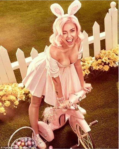 Beaming: The 25-year-old singer pretending to be spanked by the Easter bunny in one racy shot, before flaunting her cleavage in a very low-cut dress Miley Cyrus Photoshoot, Somebunny Loves You, Easter Photoshoot, Low Cut Dresses, Easter Photos, Photoshoot Themes, Bunny Ears, Vogue Magazine, Gal Gadot