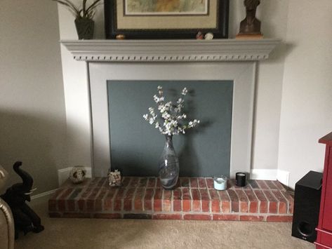 What to Do With That Fireplace You’re Not Using Homemade Fireplace, Fireplace Cover Up, Fireplace Draft Stopper, Fireplace Covers, Draft Stopper Diy, Gray Fireplace, Fireplace Area, Grey Fireplace, Fireplace Cover