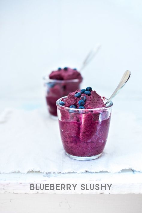 A refreshing cooling 2 ingredient Blueberry Slushy, made with only frozen Blueberries and orange juice. Healthy, vegan and delicious!! Blueberry Slushie, Frozen Blueberry Recipes, Lemonade Slushies, Feasting At Home, Slushie Recipe, Fresh Fruit Juice, Roasted Cherry, Best Gluten Free Recipes, Blueberry Recipes