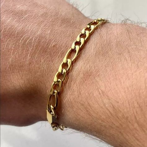 18k gold figaro chain link bracelet for men. Perfect for everyday wear. Available in 7". #gold #bracelet #mensjewelry #fashion https://whispers-in-the-wind.com/discover-the-latest-mens-accessory-trends-for-2024/?office-tech-pants-stay-comfortable-and-stylish-while-working Mens Figaro Chain, Guys Jewelry, Figaro Chain Men, Guy Jewelry, Gold Figaro Chain, Stainless Bracelet, Mens Gold Jewelry, Chic Bracelet, Mens Gold Bracelets