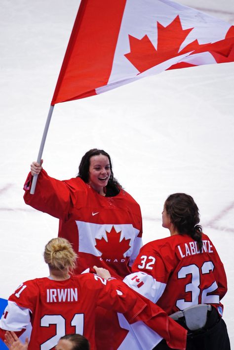 Goalkeeper Shannon Szabados of Canada (1) waves the Canadian flag after beating the U.S.A. 3-2 in overtime of the women's gold medal ice hockey game at the 2014 Winter Olympics in Sochi, Russia, Thursday, Feb. 20, 2014. (AP / Julio Cortez) Famous Canadians, Team Canada Hockey, Canada Soccer, Canada Hockey, Canadian Women, Canadian Football, Sochi Russia, Women Football, Canada Eh