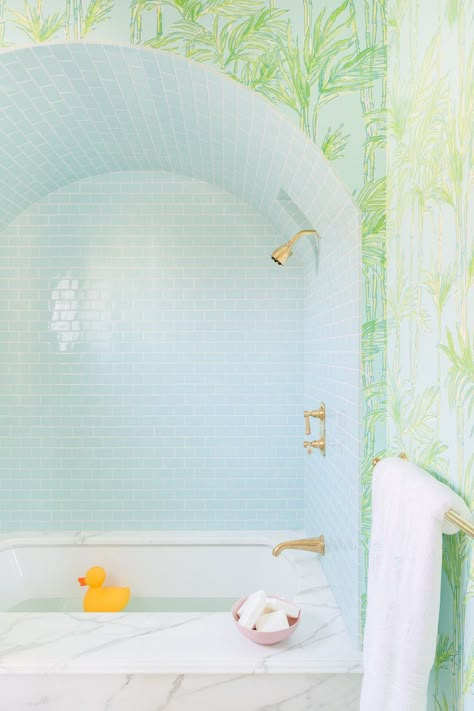 Designing a kids' bathroom is all about fun and creativity. To assemble a look that's both playful and chic, top designers rely on everything from graphic patterns to lively hues. Click through for 20 personality-packed bathrooms that would be a hit with any kid. #kidsroom #kidsbathroom #childrensbathroom #funbathrooms #bathroomdesign #modernbathrooms #bathroomwallpaper Kids Bathroom Design, Marble Tub, Childrens Bathroom, White Bathroom Designs, White Shiplap Wall, Lucky Duck, Patterned Floor Tiles, Home Luxury, Up House