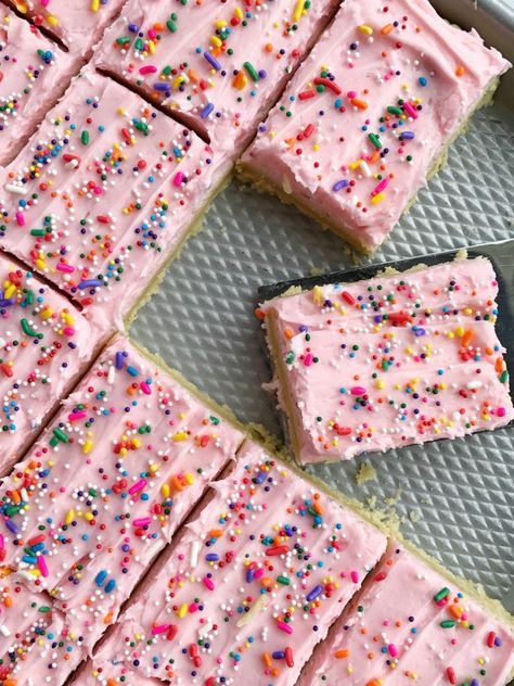 Soft, thick sugar cookie bars topped with a creamy and sweet frosting and baked in a sheet pan and perfect for a large crowd. Change up the frosting color & sprinkles for different events, parties, and/or birthdays Cookie Sheet Pan Desserts, Half Sheet Pan Bars, Sheet Pan Treats, Sheet Pan Cake Mix Cookie Bars, Sheet Pan Squares, Desserts For Potluck Parties, Cookie Bars Sheet Pan, Sheet Pan Dessert, Sheet Pan Desserts