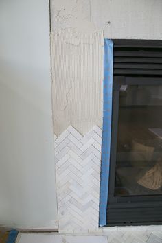 Fireplace Tile Trim, How To Tile A Fireplace, Diy Tile Fireplace Surround, Marble Herringbone Fireplace, Diy Tile Fireplace, Herringbone Fireplace Surround, Herringbone Tile Fireplace, Tile Fireplace Surround, Tile Around Fireplace