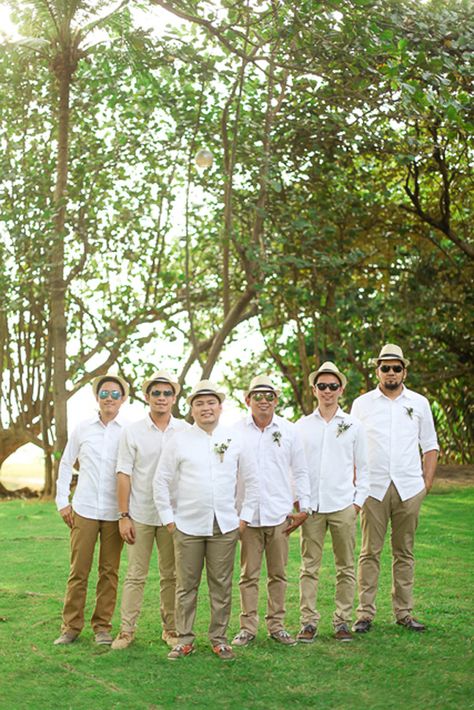 Laid-back Beach Attire | Photo: Team Benitez Photo Guest Beach Wedding Attire Men, Laid Back Groomsmen Attire, Male Beach Wedding Attire, Groomsmen Indonesia, Guayabera Wedding, Groomsmen Attire Beach Wedding, Romantic Sunset Wedding, Romantic Sunset Beach, Mens Beach Wedding Attire