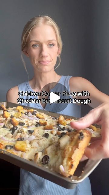 Andrea on Instagram: "✨Chicken Caesar Pizza With Cheddar Bay Biscuit Dough✨

Take one box of the cheddar bay biscuits dough and make the dough as the package says. Now take a sheet pan and spray oil on it. Put oil onto your hands then spread the dough out on the sheet pan. 

Bake at 425 degrees for about 10 minutes 

Now add your toppings. Take the garlic butter mixture from the cheddar bay biscuit dough box and make it up. Spread onto your crust with around a 1/2-3/4 cup of creamy Caesar dressing. Add 2 cups of cheese I did one cup of Italian style cheese and one cup of Monterey Jack. Add one cup of chopped cooked chicken 1/4 cup red onions sliced, 1/2 cup of black olives and 1/2 cup of croutons. Top with pepper.

Bake at 425 for 8-10 minutes. I broiled mine a couple minutes at the end. Caesar Pizza, Creamy Caesar Dressing, Dough Box, Cheddar Bay Biscuits, Chicken Caesar, Biscuit Dough, Caesar Dressing, Black Olives, Cooked Chicken