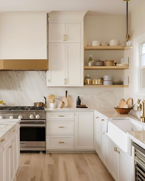 Happy Monday!! ✨✨✨ This kitchen exudes a timeless and muted elegance. The cabinetry is off-white, paired beautifully with light wood flooring, creating a serene and inviting atmosphere. The countertops and backsplash are made of quartz, adding a touch of luxury. Open shelving displays neatly arranged dishes and kitchenware, enhancing the minimalist aesthetic. The gas stove and gold-coloured accents, such as the cabinet handles and pendant light fixture, add both functionality and style to th... White And Wood Kitchen Brass Hardware, Off White Kitchen Cabinets With Quartz, White Kitchen Cabinets With Quartz, Vanilla Kitchen, Adu Kitchen, Light Wood Flooring, Off White Kitchen Cabinets, Countertops And Backsplash, Off White Kitchens