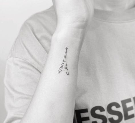 Single line Eiffel tower tattoo on the wrist Continuous Line Tattoos, Eiffel Tower Tattoo, Tattoo On The Wrist, Tower Tattoo, British Tattoo, Continuous Line Tattoo, Mo Ganji, Paris Tattoo, Back Of Arm Tattoo