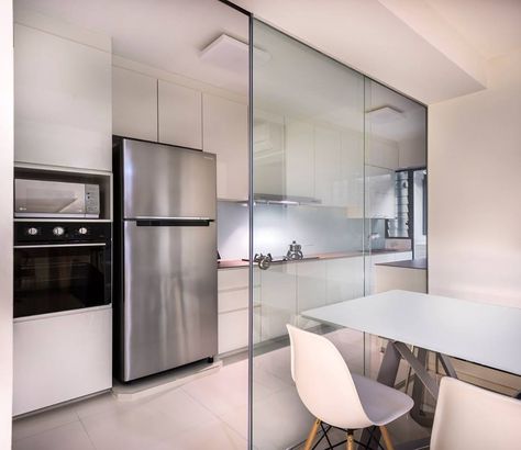 Glass panels keep the cooking fumes within the kitchen, while still allowing plenty of light to come through. Semi Open Kitchen Design, Closed Concept Kitchen, Kitchen Ideas Hdb, Kitchen Partition Ideas, Kitchen Partition, Semi Open Kitchen, Partition Ideas, Closed Kitchen, Open Kitchen And Living Room