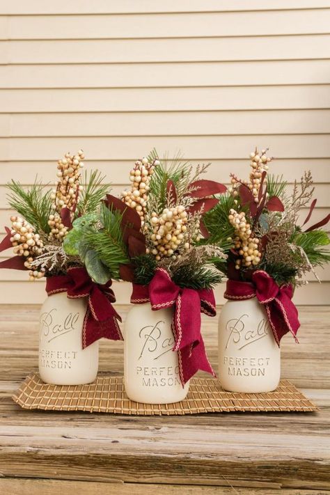 16 Best Winter Mason Jar Centerpieces for Weddings | Emmaline Bride Mason Jar Christmas Flower Centerpieces, Diy Mason Jar Centerpieces, Water Rangoli, Upcycle Jars, Mason Jar Christmas Decorations, Jars Decor, Mason Jar Christmas Crafts, Holiday Mason Jar, Mason Jar Christmas