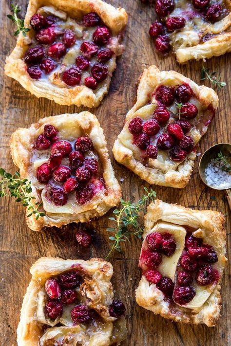 Cranberry Brie Pastry Tarts | halfbakedharvest.com #brie #cranberries #appetizers #thanksgiving #christmas Thanksgiving Food With A Twist, Thanksgiving Recipes With Cranberries, Thanksgiving Twist Recipes, Thanksgiving Cranberry Recipes Side Dishes, Twist On Thanksgiving Recipes, Creative Thanksgiving Side Dishes, Thanksgiving With A Twist, Non Traditional Thanksgiving Recipes, Thanksgiving Recipes Non Traditional