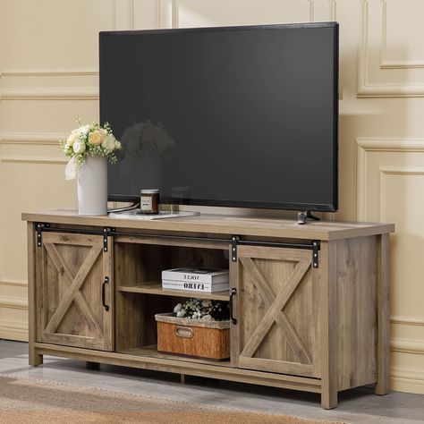 PRICES MAY VARY. 📺SIMPLE & RUSTIC FARMHOUSE STYLE – If you are a fan of rustic farmhouse style and love to add some natural sense to your living room, then this farmhouse style TV stand with sliding barn doors is your best choice. The simple yet stylish barndoor and farmhouse design is perfect for all home decor styles! 📺PREMIUM MATERIAL WITH VIVID WOOD GRAIN – Made of high-quality MDF material and covered by premium ABS finish with vivid wood grain, this wooden TV stand and media center is built not only for the long-lasting service but also for decorative and stylish purpose. It is safe for home and friendly to the human body. 📺STRONG & STURDY STEEL SLIDING RAIL – The two rustic barndoor on the front of this TV stand for consoles and media players are hung on a metal sliding rail made Modern Farmhouse Tv Stand, Farmhouse Style Tv Stand, Tv Stand For Living Room, Media Entertainment Center, Farmhouse Tv, Large Storage Cabinets, Rustic Tv Stand, Wooden Tv, Farmhouse Tv Stand